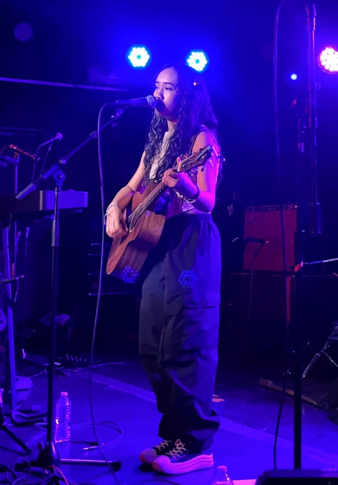 Julia onstage with guitar